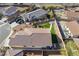 Aerial view of a house showcasing the backyard with artificial turf and neighborhood at 4790 Toscana Pl, Pahrump, NV 89061