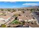 Aerial view of a neighborhood featuring single-story homes, desert landscaping, and mountain views at 4790 Toscana Pl, Pahrump, NV 89061