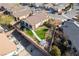 View of home with large backyard featuring artificial turf, desert landscaping, and a covered patio at 4790 Toscana Pl, Pahrump, NV 89061