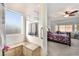 Bathroom featuring a walk-in shower with a built-in bench and a view of the bedroom at 4790 Toscana Pl, Pahrump, NV 89061