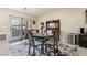 Inviting dining area featuring a stylish table, chairs, and sliding door to outdoor area at 4790 Toscana Pl, Pahrump, NV 89061