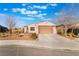 Attractive single-story home with desert landscaping, a spacious driveway, and inviting curb appeal at 4790 Toscana Pl, Pahrump, NV 89061