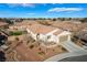 View of a home with desert landscaping, driveway, and an attached two car garage at 4790 Toscana Pl, Pahrump, NV 89061