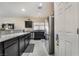 Spacious kitchen featuring stainless steel appliances, granite countertops and dark cabinetry at 4790 Toscana Pl, Pahrump, NV 89061