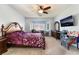 Bedroom featuring a large bay window and mounted TV at 4790 Toscana Pl, Pahrump, NV 89061