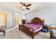 Cozy bedroom with a ceiling fan and carpeted floors at 4790 Toscana Pl, Pahrump, NV 89061