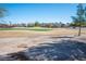 Expansive view of the golf course with homes in the background at 4980 Black Bear Rd # 104, Las Vegas, NV 89149