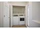 Conveniently located laundry room with side-by-side washer and dryer at 4980 Black Bear Rd # 104, Las Vegas, NV 89149