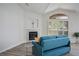 Inviting living room features a fireplace, vaulted ceilings, and bright windows with plantation shutters at 4980 Black Bear Rd # 104, Las Vegas, NV 89149