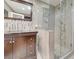 Beautiful bathroom with a dark wood cabinet, glass shower door, and stunning shower details at 5200 Valley Glen St, Las Vegas, NV 89119