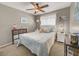 Cozy bedroom with ceiling fan, inviting bed, storage options and soft, natural light from the window at 5200 Valley Glen St, Las Vegas, NV 89119