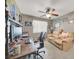 Bedroom features a desk, and love seat with a ceiling fan at 5200 Valley Glen St, Las Vegas, NV 89119