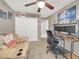 Bedroom featuring a ceiling fan, closet, sofa, and a sleek desk for work or relaxation at 5200 Valley Glen St, Las Vegas, NV 89119