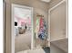 View into a pink bedroom with a chair and a bed and double mirrored closets at 5200 Valley Glen St, Las Vegas, NV 89119