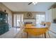 Dining room boasts a brick fireplace, french doors, and bright lighting at 5200 Valley Glen St, Las Vegas, NV 89119