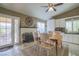 Cozy dining area features a brick fireplace and a door leading to the backyard at 5200 Valley Glen St, Las Vegas, NV 89119