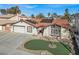 Single-story home with well-maintained lawn and two-car garage at 5200 Valley Glen St, Las Vegas, NV 89119