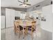 Spacious eat-in kitchen featuring an island, white cabinets, and modern appliances at 5200 Valley Glen St, Las Vegas, NV 89119