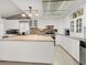 Bright kitchen features recessed lighting, white cabinetry, stone backsplash, and a center island at 5200 Valley Glen St, Las Vegas, NV 89119