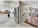 Bright kitchen featuring white cabinetry, stainless steel appliances and a center island at 5200 Valley Glen St, Las Vegas, NV 89119