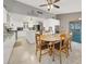 Open kitchen and dining area featuring white cabinets and vaulted ceilings at 5200 Valley Glen St, Las Vegas, NV 89119