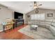 Cozy living room with a fireplace, comfortable seating, and wood-look floors at 5200 Valley Glen St, Las Vegas, NV 89119