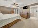 Relax in the main bedroom featuring a ceiling fan, dresser, and access to an ensuite bathroom at 5200 Valley Glen St, Las Vegas, NV 89119