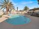 A backyard pool with palm trees and lounge seating at 5200 Valley Glen St, Las Vegas, NV 89119