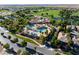 Aerial view of community featuring pool and recreation center surrounded by lush greenery at 5698 Hoptree Dr # 1, Pahrump, NV 89061