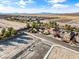 Expansive aerial view of a home's neighborhood, with desert landscape and some homes already built at 5698 Hoptree Dr # 1, Pahrump, NV 89061