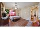 Bedroom featuring wood-look floors, a ceiling fan, and a seating area at 5698 Hoptree Dr # 1, Pahrump, NV 89061