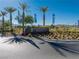 Mountain Falls community sign features palm trees and desert landscaping at 5698 Hoptree Dr # 1, Pahrump, NV 89061