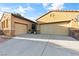 Home exterior featuring a wide driveway with three car garage at 5698 Hoptree Dr # 1, Pahrump, NV 89061