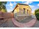 Exterior view of home featuring stone accents, low maintenance landscaping, and brick pathway at 5698 Hoptree Dr # 1, Pahrump, NV 89061