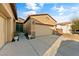 Lovely home with well-kept landscaping, a three-car garage, and front door planters at 5698 Hoptree Dr # 1, Pahrump, NV 89061