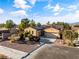 Beautiful home with a well-manicured yard, solar panels, and a two-car garage, creating a great curb appeal at 5698 Hoptree Dr # 1, Pahrump, NV 89061