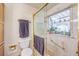 Bright bathroom with framed shower door, storage, and a vanity at 5715 Gilbert Ln, Las Vegas, NV 89130