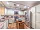 Well-lit kitchen with stainless steel appliances, an island, and ample cabinet space at 5715 Gilbert Ln, Las Vegas, NV 89130