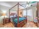 Stylish bedroom featuring Saltillo tile flooring and a four-poster bed at 5715 Gilbert Ln, Las Vegas, NV 89130