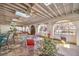 Bright sunroom with brick floor, skylights, arched windows, ceiling fans, and fountain at 5715 Gilbert Ln, Las Vegas, NV 89130