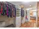 Walk-in closet with custom shelves, drawers, and an organized clothing and accessories, leading to bedroom at 5715 Gilbert Ln, Las Vegas, NV 89130