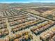 Aerial view of a residential neighborhood in Las Vegas with similar style homes and desert surroundings at 5971 Sonoma Station Ave, Las Vegas, NV 89139