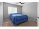 Simple, bright bedroom, features a bed and a large, bright window at 5971 Sonoma Station Ave, Las Vegas, NV 89139