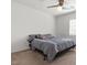 Cozy bedroom featuring a queen bed, ceiling fan, neutral carpet and bright windows at 5971 Sonoma Station Ave, Las Vegas, NV 89139