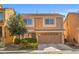 Charming two-story home featuring a well-manicured front yard and a convenient two-car garage at 5971 Sonoma Station Ave, Las Vegas, NV 89139