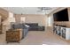 Spacious living room filled with natural light, featuring comfortable seating and a modern ceiling fan at 5971 Sonoma Station Ave, Las Vegas, NV 89139