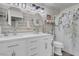 Modern bathroom design with shiplap wall, a double vanity and decorative mirrors at 6109 Flaming Arrow Rd, North Las Vegas, NV 89031