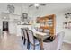 Formal dining room with a spacious wooden table, chairs, and hutch at 6109 Flaming Arrow Rd, North Las Vegas, NV 89031