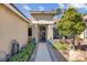 Inviting front entrance with lush landscaping and a decorative door at 6109 Flaming Arrow Rd, North Las Vegas, NV 89031