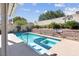 Relaxing pool features a pristine spa, set against a backdrop of lush landscaping and beautiful hardscaping at 6109 Flaming Arrow Rd, North Las Vegas, NV 89031